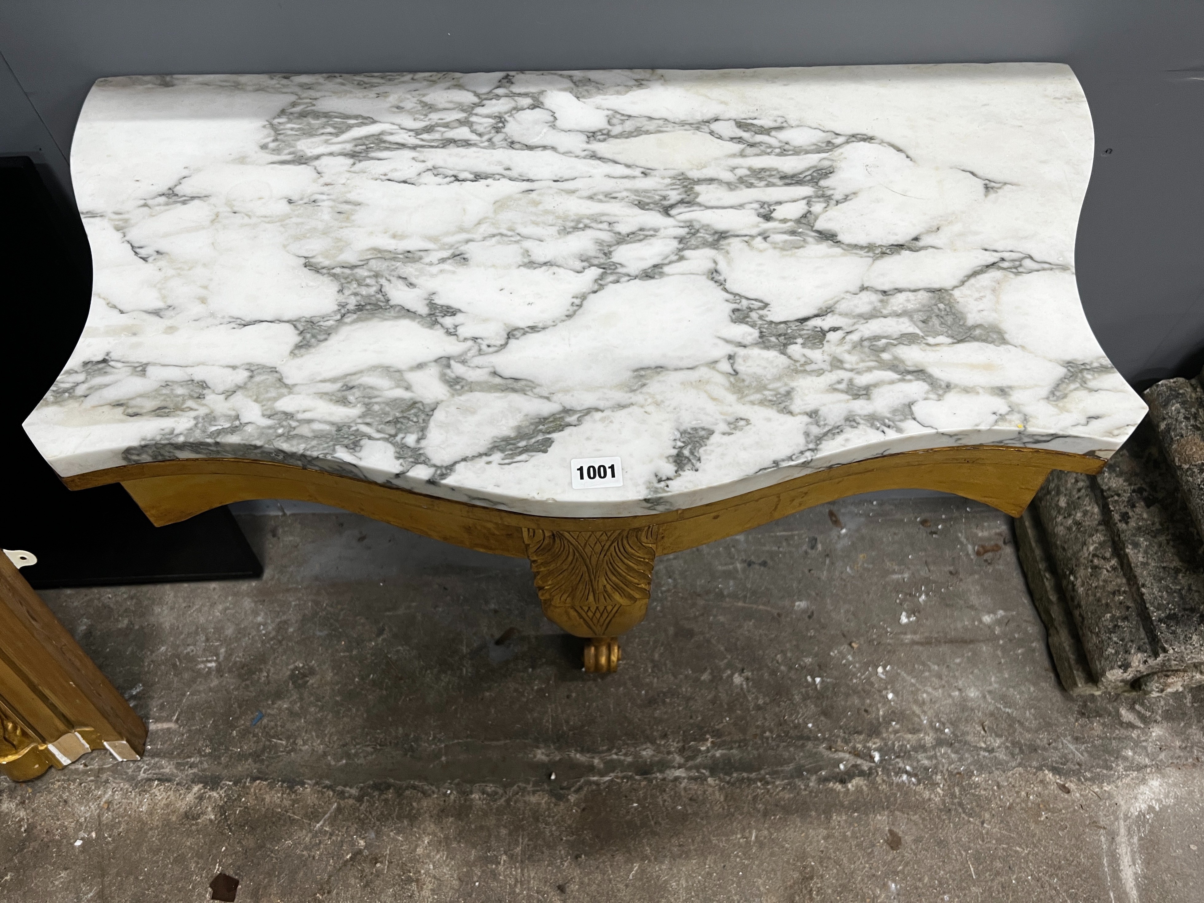 A Victorian style carved giltwood marble topped serpentine console table, width 84cm, depth 44cm, height 79cm